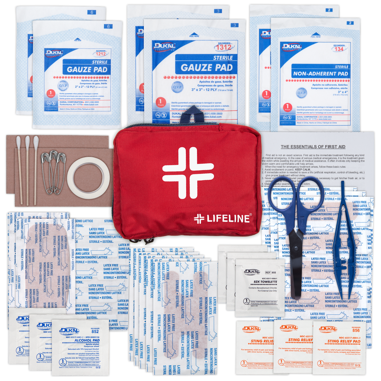 First aid kit with various supplies including gauze pads, scissors, and bandages on a white background.