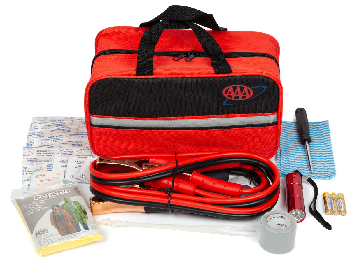 AAA emergency car kit with red bag, jumper cables, flashlight, and other tools on a white background