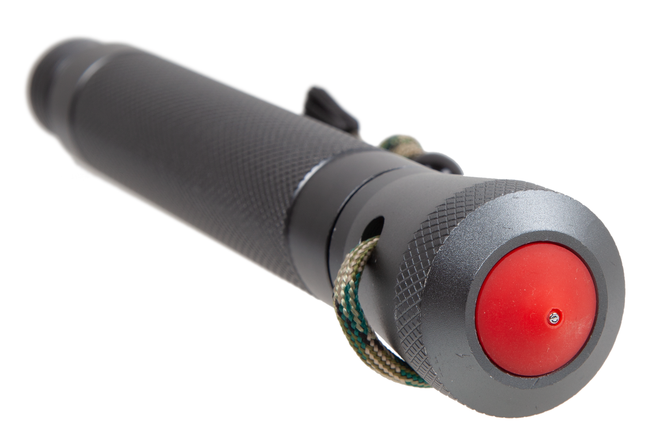 Black and gray device with a red button on a white background