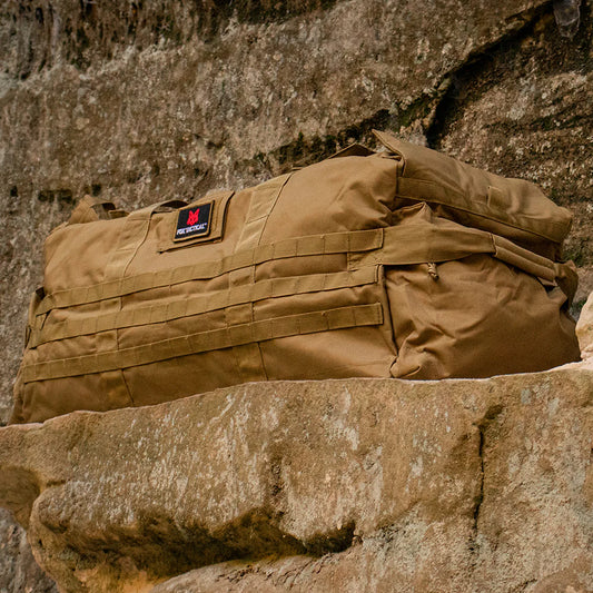 Brown tactical backpack on a stone surface
