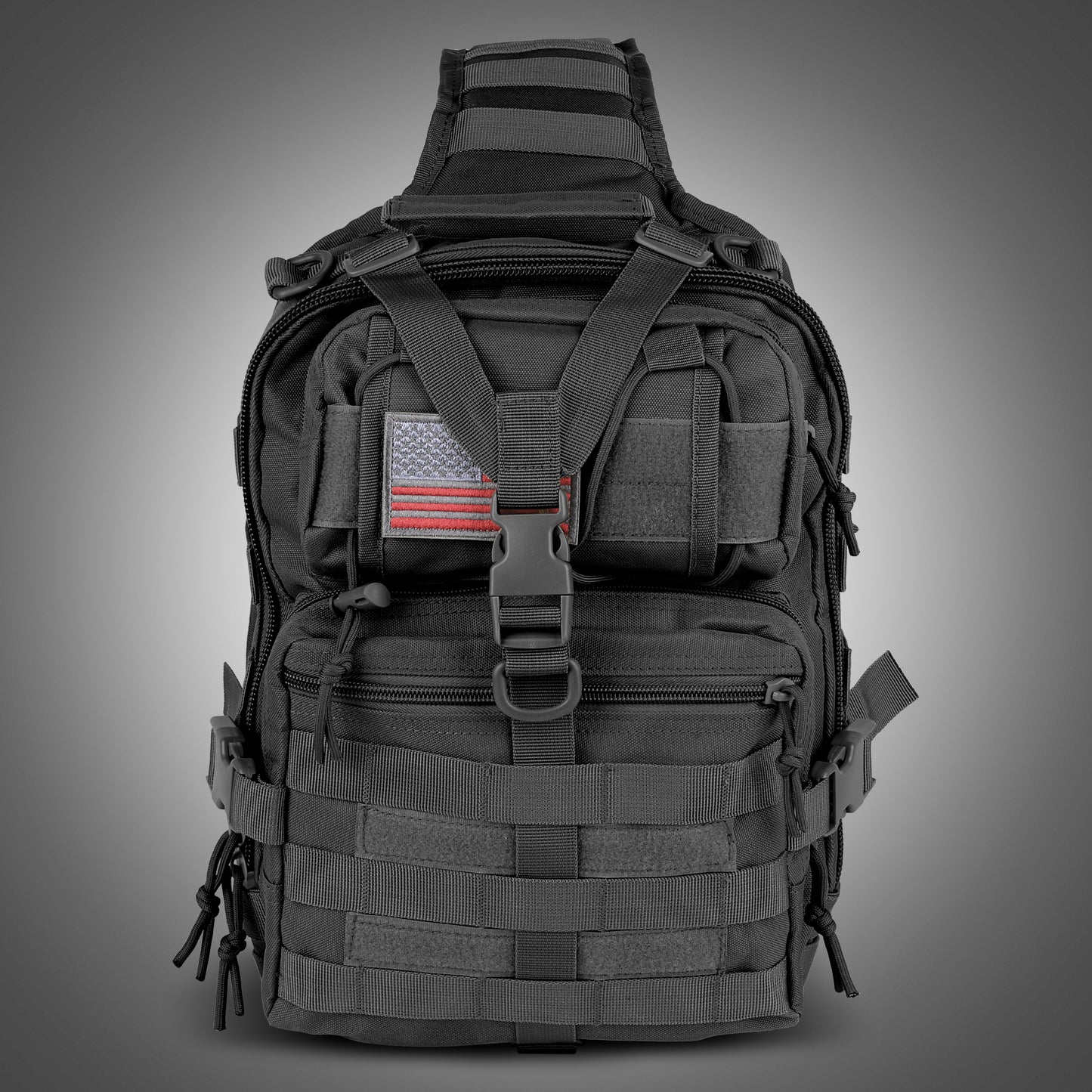Black tactical backpack with American flag patch on a gray background
