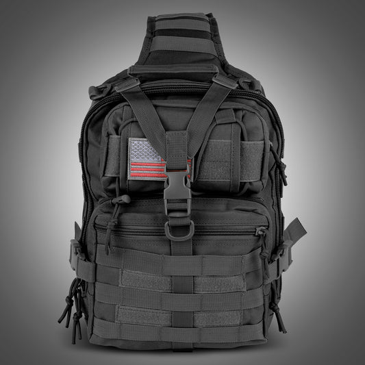 Black tactical backpack with American flag patch on a gray background